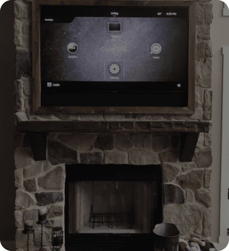 Stone fireplace with TV mounted above it.
