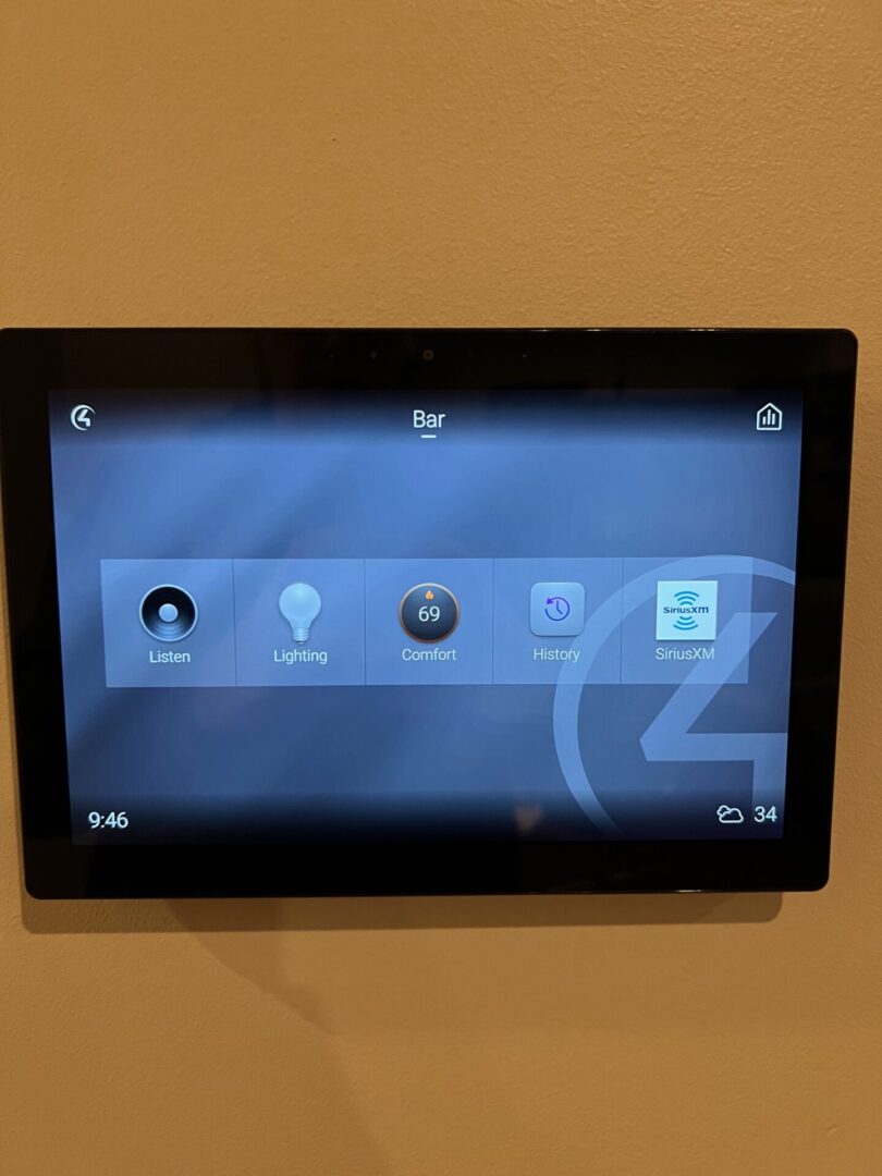 Tablet displaying a home screen with user icons and apps.